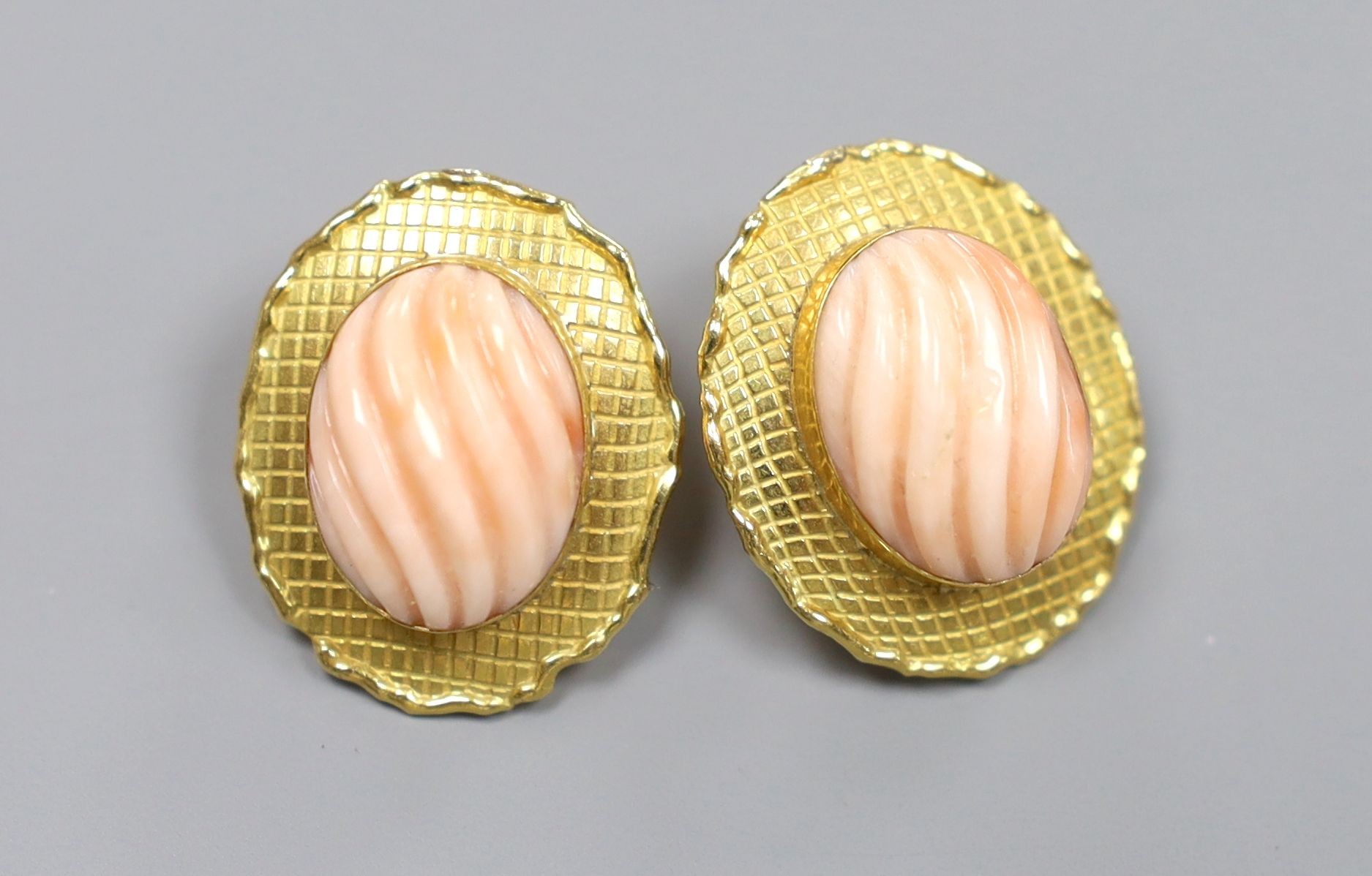 A pair of modern 750 and fluted coral bead set ear clips, 23mm, gross 10.7 grams.